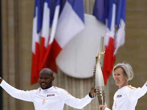 Olympic torch relay works its way past Paris landmarks in buildup to Games