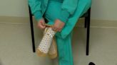 Devoted to caring: Nurse gives the shoes off her feet to a patient who needed a new pair