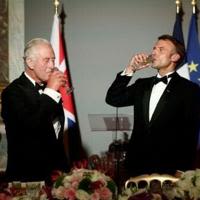 Britain's King Charles and French President Emmanuel Macron toast their countries' friendship