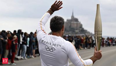 France's Bastille Day parade meets the Olympic torch relay in an exceptional year - The Economic Times