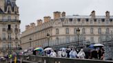 Paris barricades start to come down after opening ceremony on the Seine, but many still struggling