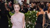 Phoebe Dynevor had 300 hand-sewn lace flowers on her Met Gala gown by Victoria Beckham