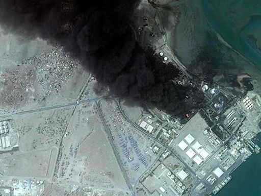 Yemeni port still burning days after Israeli air strikes