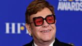 Elton John is seen in adorable family photo alongside his sons