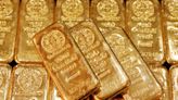 Gold edges lower, fall capped by weaker dollar and recession fears