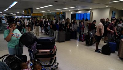 Flight cancellations continue Sunday as United, Delta struggle to recover from outage