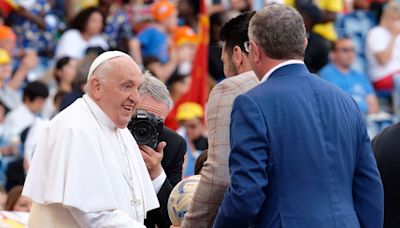 Pope Francis turns footballer as he kicks off World Children's Day