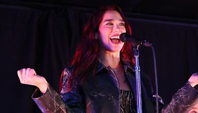 Dua Lipa Wore a transparent Bedazzled Dress for a Surprise Performance in Times Square