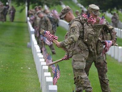 ‘Preserve their legacy’: Old Guard places flags on graves of fallen service members at Arlington for Memorial Day