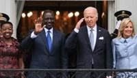 ... of Kenya, Kenyan President William Ruto, US President Joe Biden and First Lady Jill Biden wave to the crowd during an official arrival ceremony...