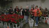 Workers at Kroger warehouse in Middletown prepare Garland of Roses