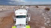 Floodwaters inundate Minnesota towns while another storm transformed New Mexico village into a lake