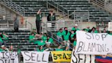 A's met by fans in Oakland with chants of `Sell the team!'