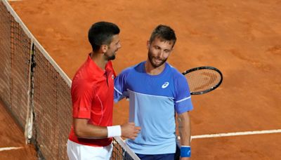 Djokovic says he’s ‘fine’ after being hit on the head by a water bottle