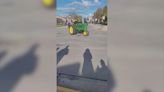 Students in Denmark drive farm equipment to school