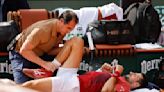 Novak Djokovic's French Open title defense ends because of an injured knee
