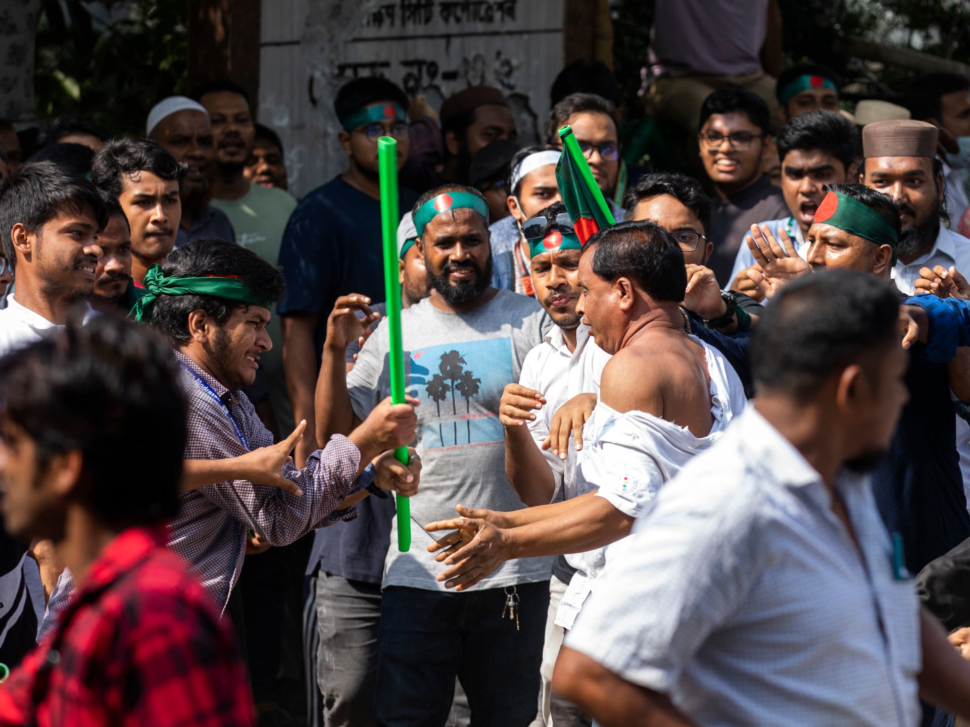 Bangladesh protesters, vowing to ‘guard revolution’, beat Hasina supporters