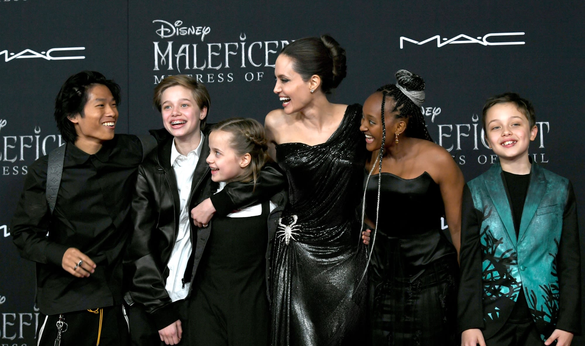 Angelina Jolie’s Motherhood Style Evolution: Muted Tones, Classic Silhouettes and More Coordinated Red Carpet Looks With Her Kids