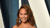 Chrissy Teigen Is Ethereal in a Romantic White Dress & Hidden Heels for ‘The Way Down’ Premiere With John Legend