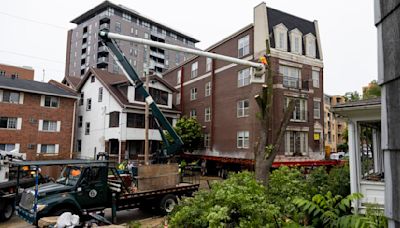 A 400-ton apartment building will continue its trip Downtown today