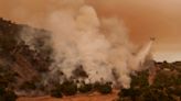 Fire crews tackle California wildfires as US heatwave continues