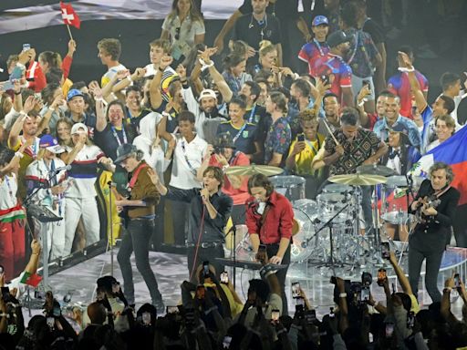 Olympic Games chaos as hundreds of athletes climb onto stage during closing ceremony