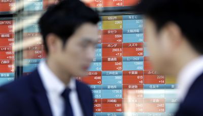 Japan’s Topix, Nikkei Stock Gauges Tumble Almost 20% From Peaks
