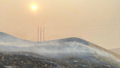 A man is accused of pushing a burning car into a gully, causing a California wildfire that’s spread to over 145,000 acres