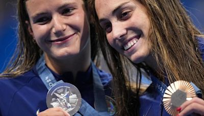 American swimmers grabbed plenty of hardware Monday at the Olympics, but no gold