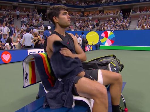 David Ferrer cuddles up to Carlos Alcaraz before the Davis Cup