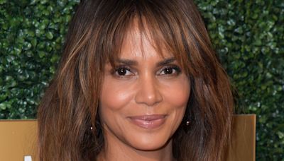 Halle Berry poses topless with cats to celebrate Catwoman anniversary