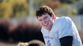 He snaps the ball, and this NC high school football lineman keeps 3,600 students happy