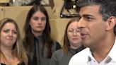 Tory staffer tries to block woman laughing at Rishi Sunak from being seen on TV