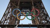 Paris Olympics organizers unveil a display of the five Olympic rings mounted on the Eiffel Tower - The Boston Globe