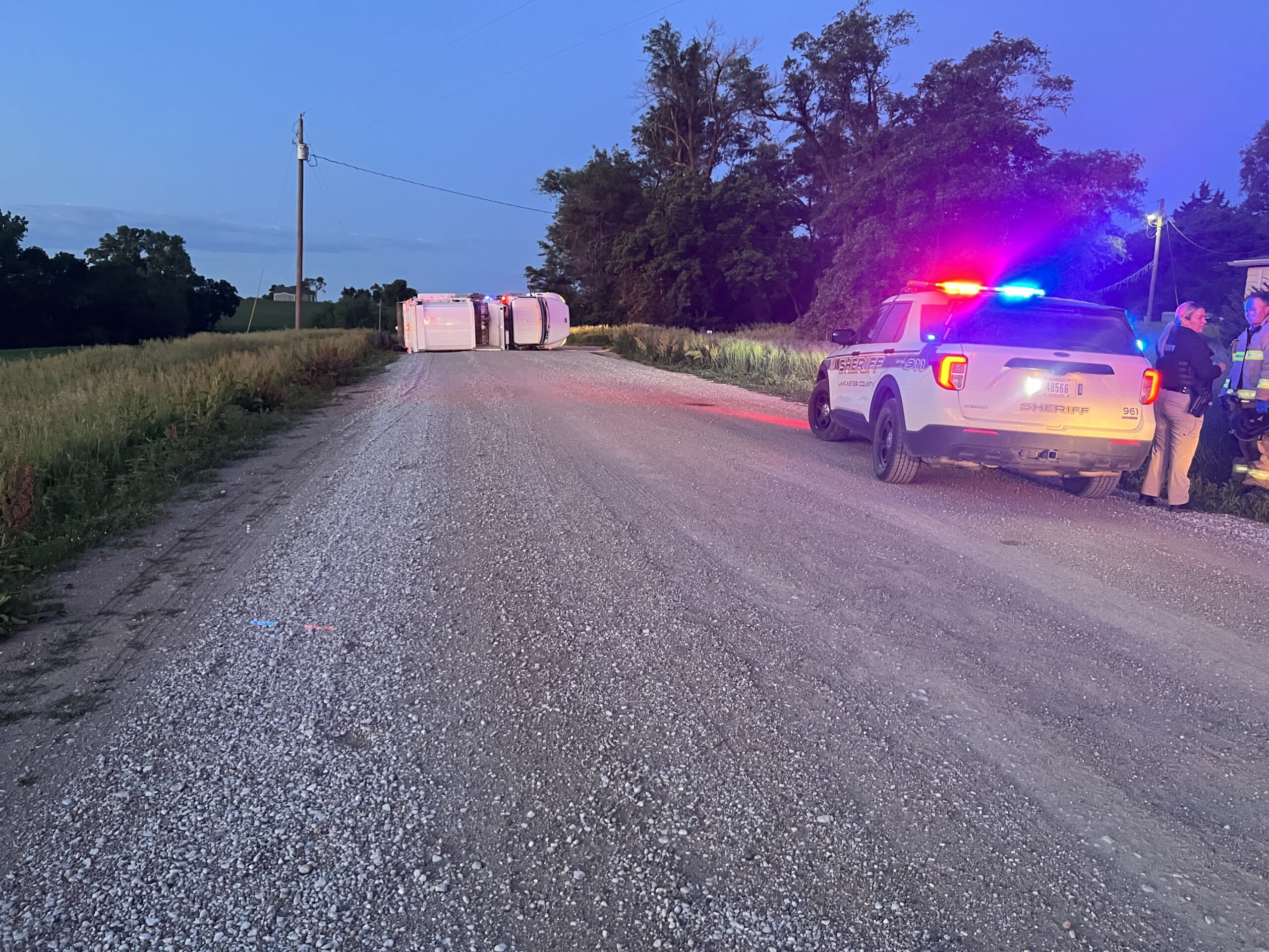 Overturned garbage truck blocking road southwest of Lincoln