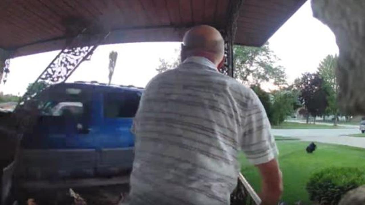 Man narrowly escapes as truck smashes into his garage