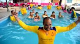 Calvin swim team teaches students in Thailand swim, survival skills