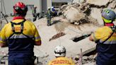 Rescue effort for dozens missing in South Africa building collapse are boosted by 1 more survivor