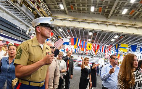 ‘I could do anything now’: Top enlisted Marine reflects on his citizenship journey as new Americans are naturalized on USS Bataan