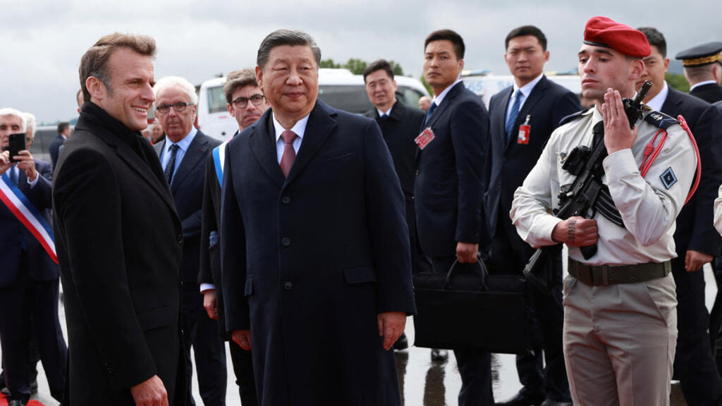 Macron and Xi have mountain outing and hope to ease tensions