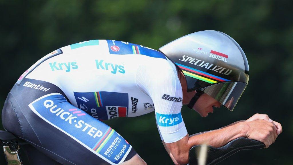 Evenepoel wins time-trial as Pogacar stays in yellow