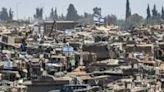 Israeli army main battle tanks and other military vehicles are positioned in southern Israel near Gaza, where tanks have already been sent in to the Rafah area