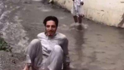 Watch: Boy Tries To Leap Over Flooded Road, Lands Bang In The Middle Of It - News18