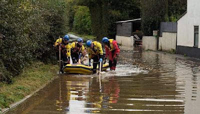 Family with four-month-old baby rescued from flooded home | ITV News