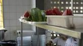 A cook serves food to the students at the municipal Burle Marx school in Rio de Janeiro, Brazil, on April 4, 2024