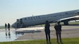 Cabin footage shows moment Delta flight completes emergency landing without front landing gear