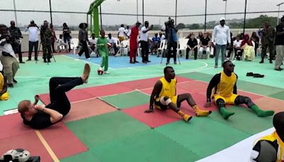 Prince Harry enjoys game of sitting volleyball as Meghan cheers him on during Nigeria visit