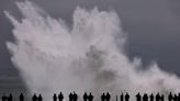 Huge waves smash California beaches, injuring eight and leaving buildings flooded