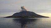 More than 2,100 people are evacuated as an Indonesian volcano spews clouds of ash