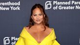 Chrissy Teigen hits back after critics claim she’s not using baby carrier correctly: ‘She is safe’